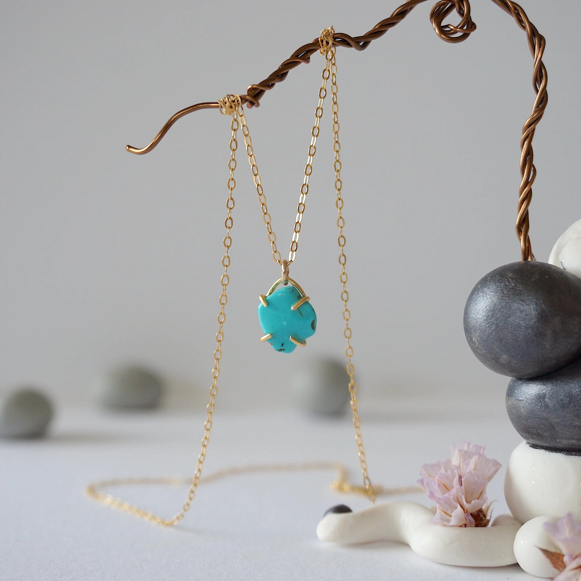 14k gold vermeil turquoise necklace close up showing claw setting and raw stone detail