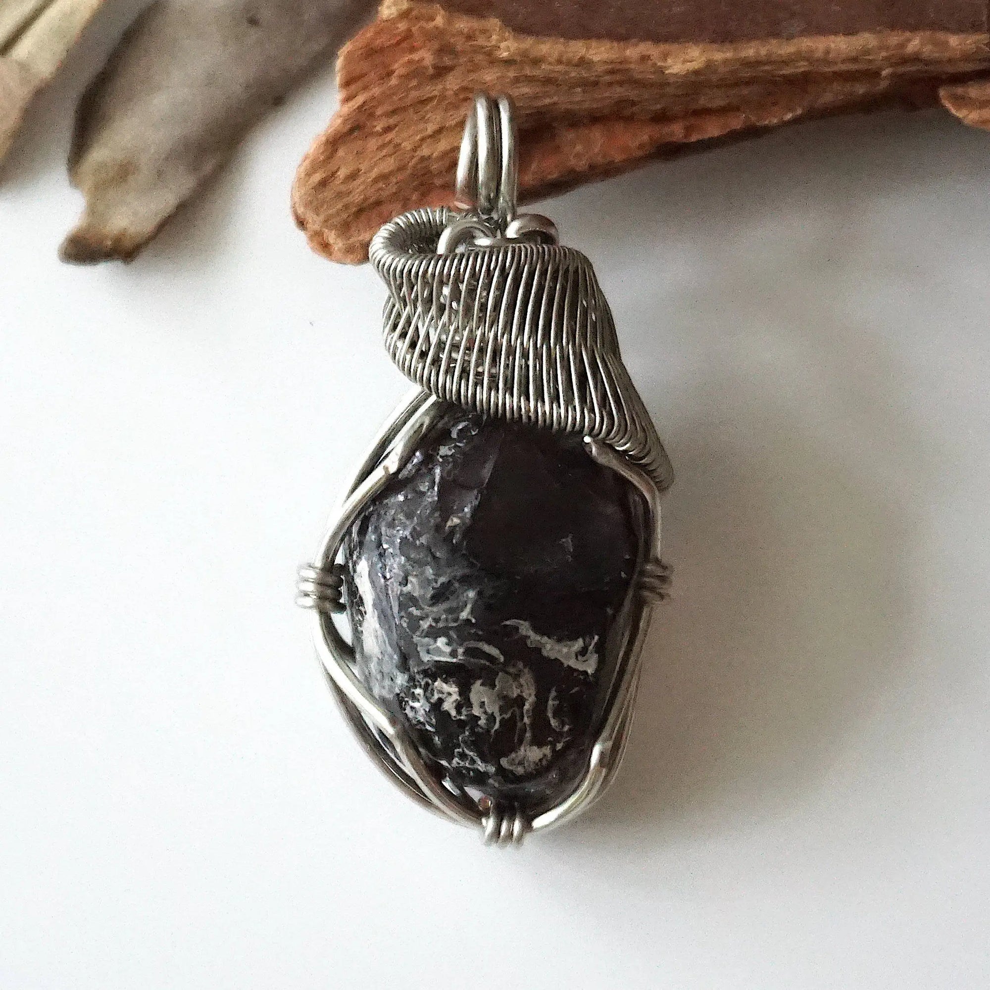 Front angle close-up of apache tears obsidian necklace – detailed artisan wire wrapping, natural volcanic glass, handcrafted pendant.
