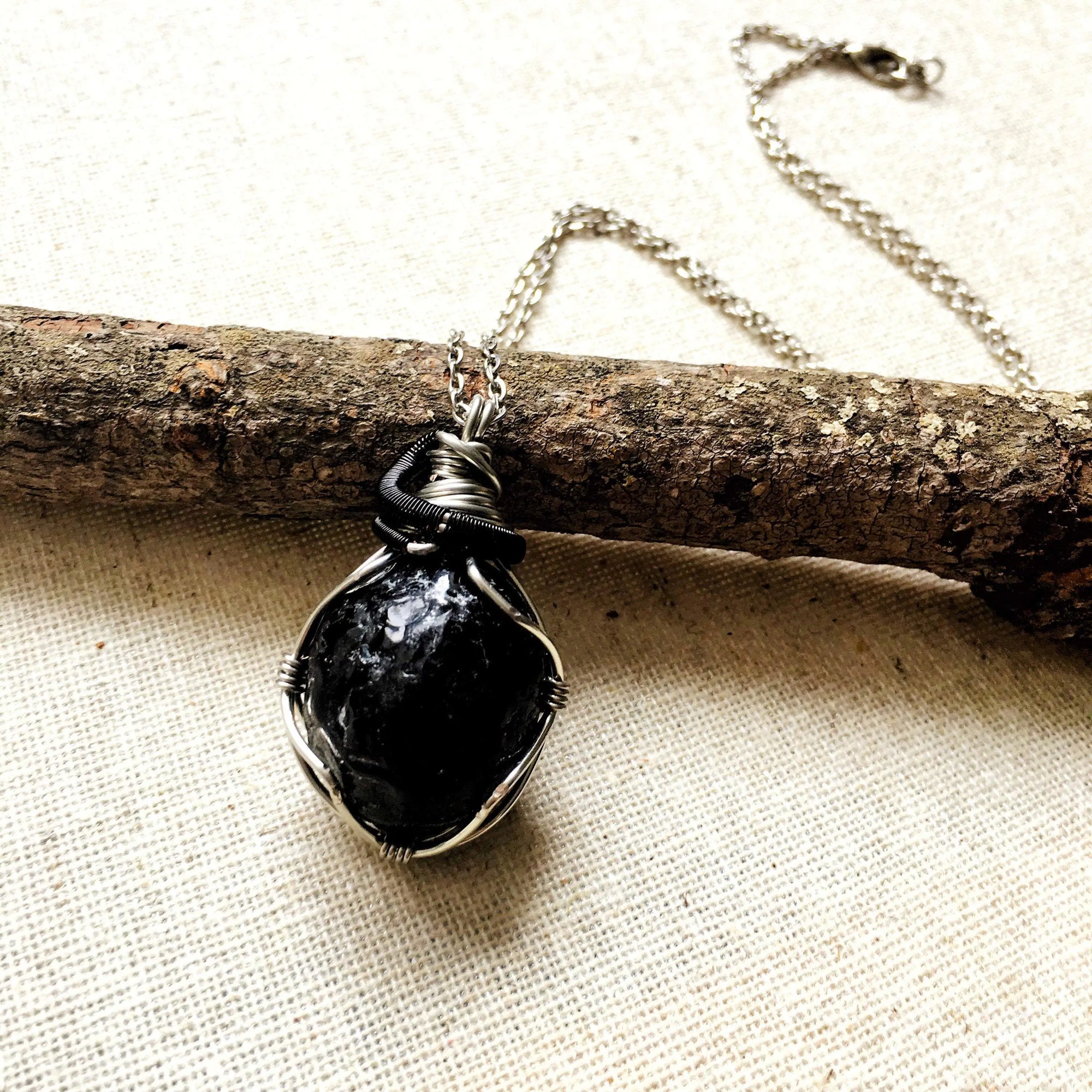 Handcrafted apache tears obsidian necklace for men, front view – artisan white gold and black copper wire wrapping, natural volcanic glass, Designs by Nature Gems.