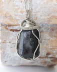 Handcrafted raw black tourmaline necklace for men, front view – artisan dark silver copper wire wrapping, natural October birthstone pendant.