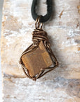 Back angle view of Australian boulder opal necklace for men – showcases wire wrapping and natural opal matrix.