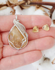 Citrine jewelry set held in hand showing size of wire wrapped necklace and stud earrings - handmade crystal gift set
