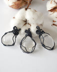 Three clear quartz pendants – showing natural variation in size, shape, gunmetal copper wire wrapping.