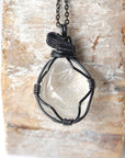 Handcrafted clear quartz necklace for men on a gunmetal chain – artisan wire wrapped, April birthstone, natural crystal pendant.