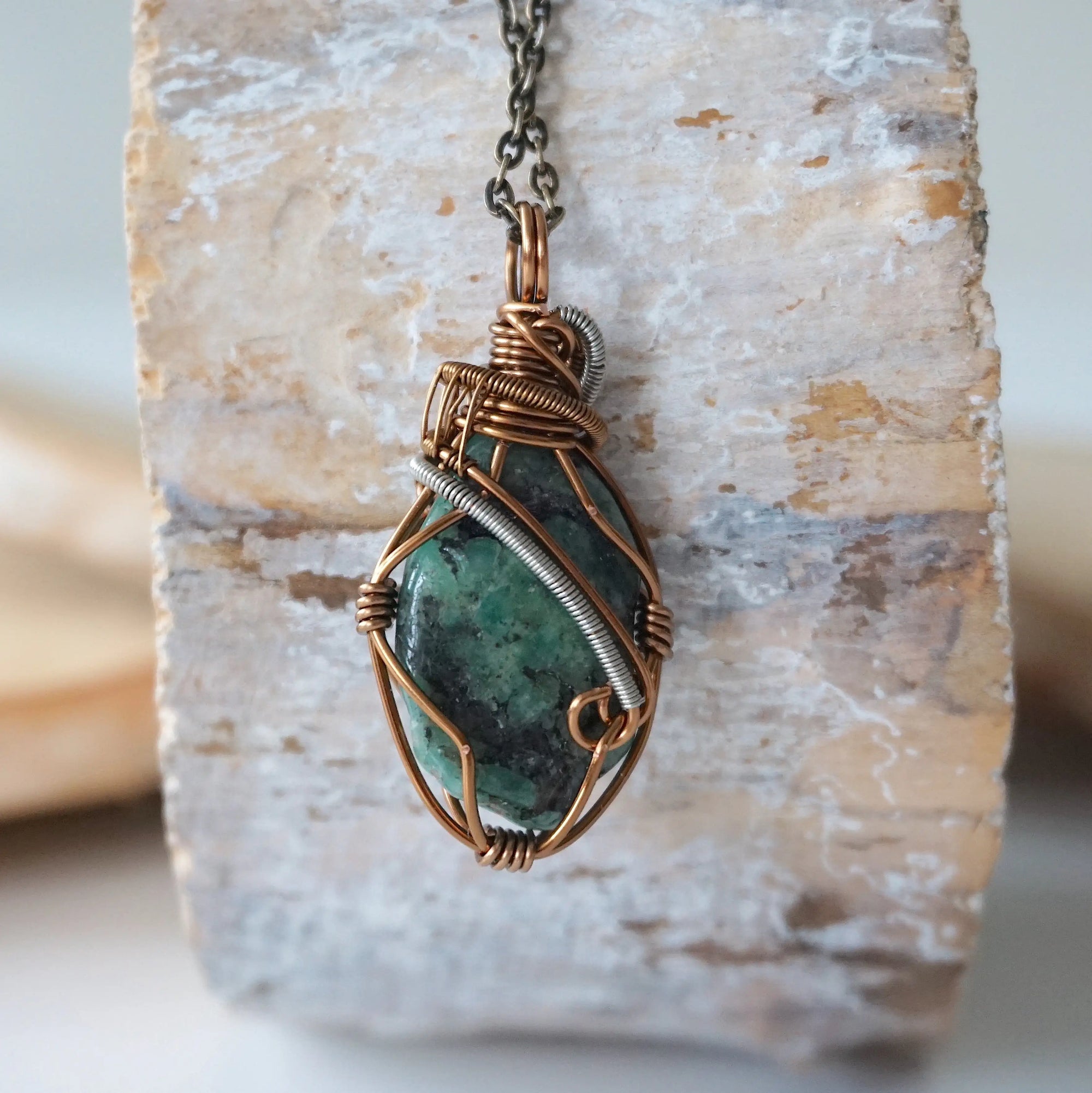 Back view of handcrafted emerald necklace – natural stone and wire wrapping detail, May birthstone pendant by Designs by Nature Gems.