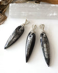 Three Orthoceras fossil pendants for men – showing natural variation in size, shape, and prehistoric pattern, 925 sterling silver wire wrapping.