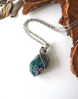 Handcrafted peacock ore necklace for men, laying flat on white gold chain – artisan wire wrapped, Capricorn and Cancer birthstone, natural crystal pendant.