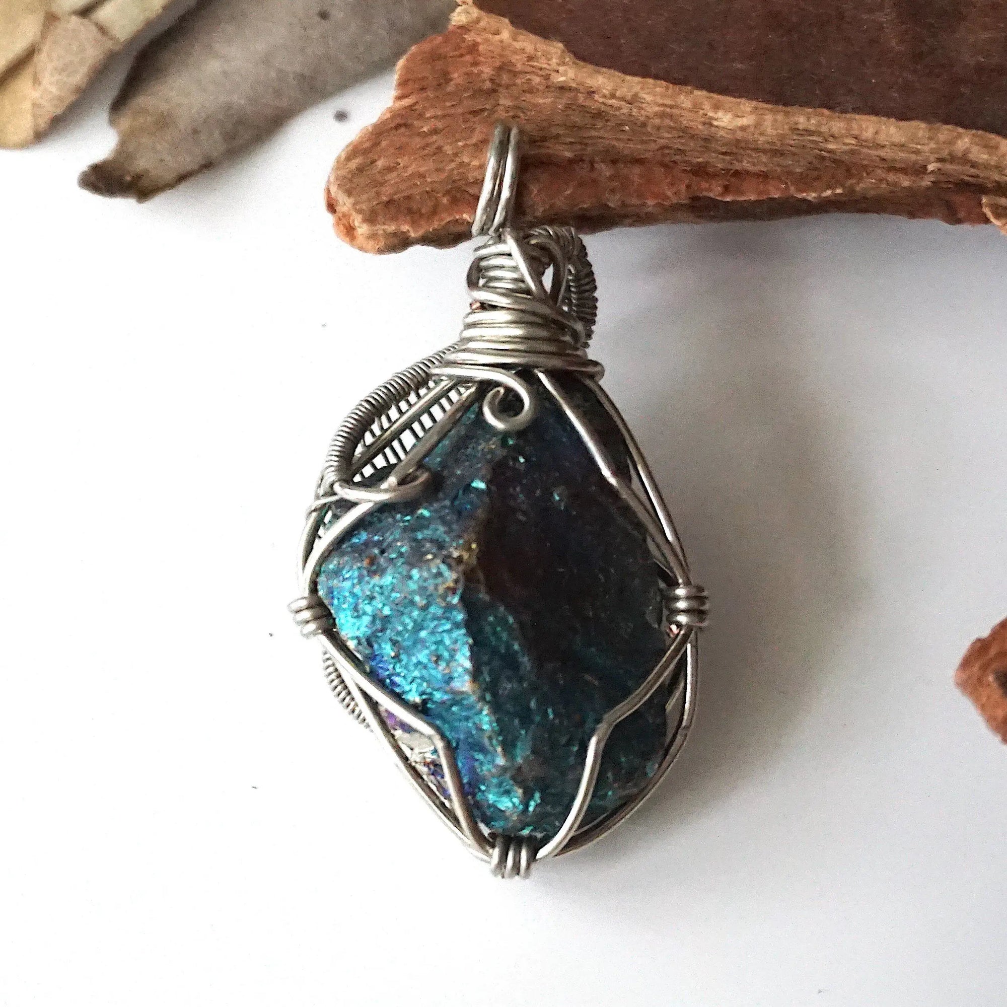 Back view of handcrafted peacock ore pendant for women – natural stone and detailed wire wrapping, Capricorn and Cancer birthstone.