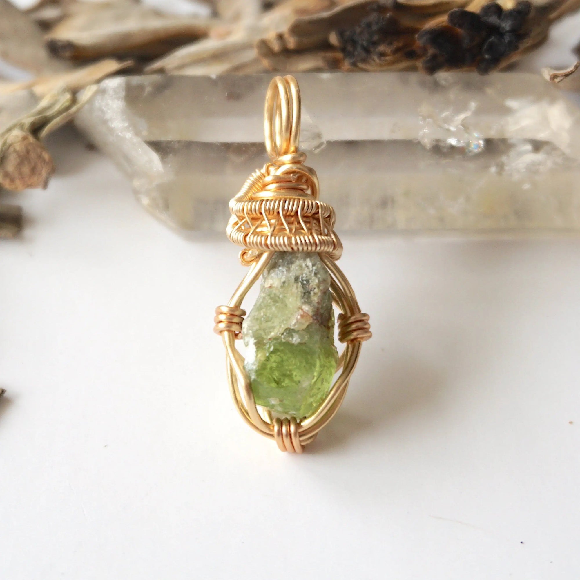 Handcrafted raw peridot necklace for women, front view – artisan warm gold copper wire wrapping, lively green stone.