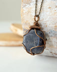 Left angle close-up of sapphire necklace – highlighting unique wire-wrapped artistry, genuine sapphire, gender-inclusive jewelry.