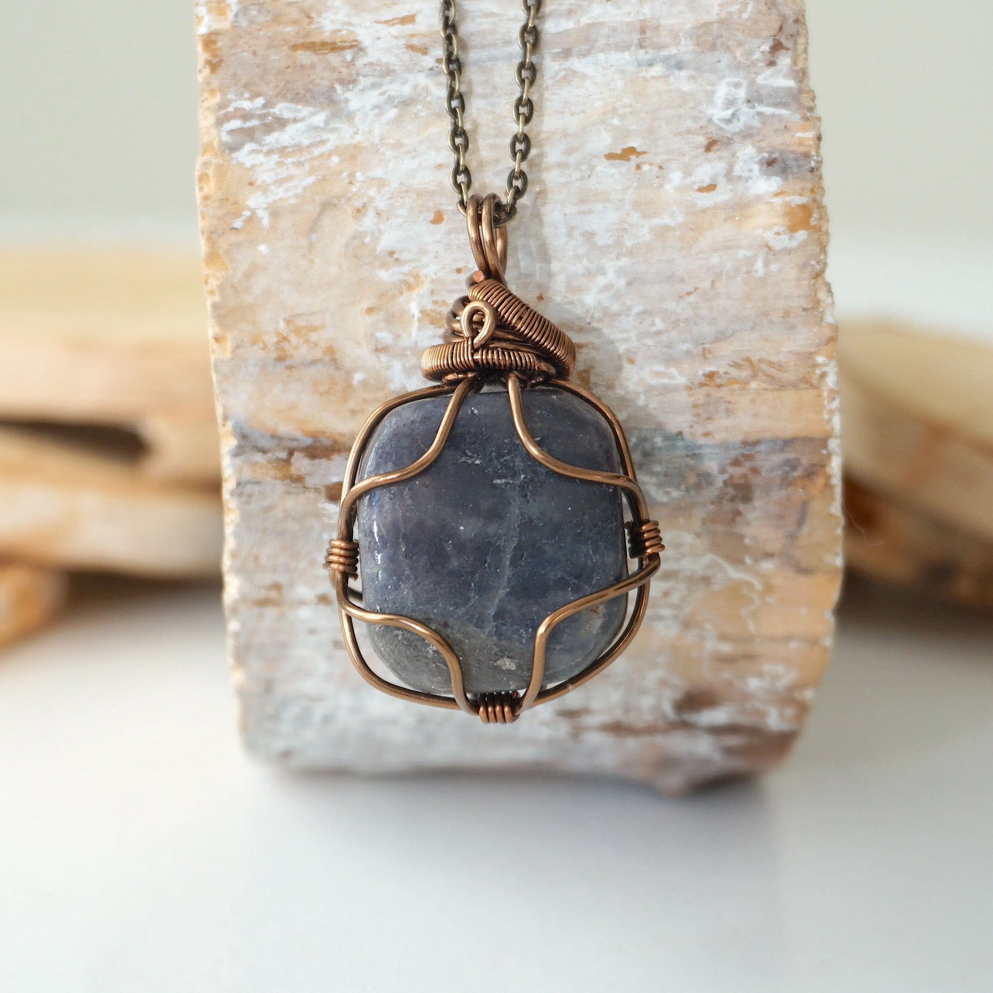 Back view of handcrafted sapphire necklace – natural stone and wire wrapping detail, September birthstone pendant by Designs by Nature Gems.