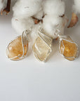 Three wire wrapped citrine necklaces showing natural stone color variation from honey to amber and size options
