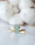 Detailed front angle of adjustable aquamarine ring, raw aquamarine, 14k gold vermeil prong setting