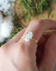 Adjustable raw rainbow moonstone ring on hand in 14k gold vermeil setting, natural moonstone flash, June birthstone ring for women.