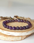 Detailed view of amethyst beaded stretch bracelet, natural 8mm amethyst beads, unisex design