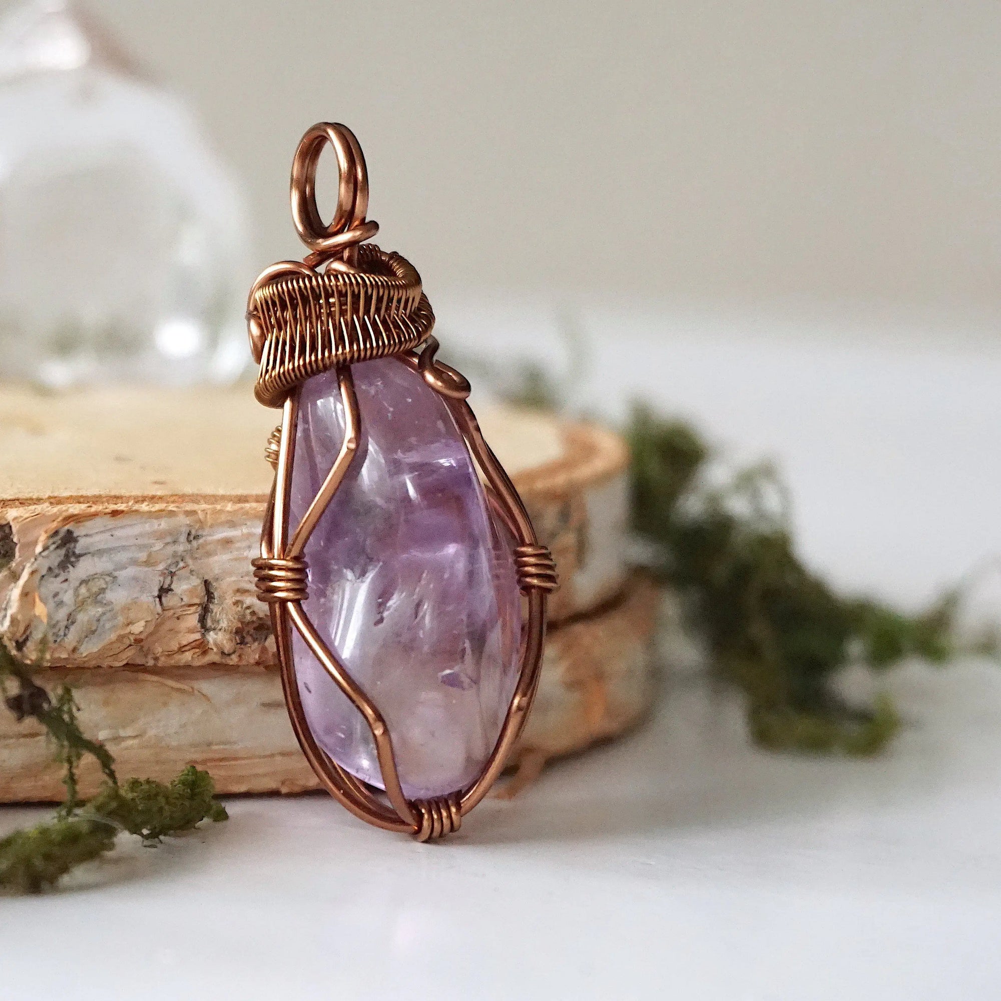 Right side angle of women’s amethyst necklace, lighter violet amethyst, antique bronze copper wire wrap