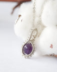 Left side angle of women’s amethyst necklace, 8mm amethyst bead, artisan silver plated copper wire wrap