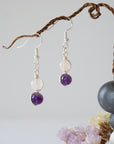 Front view of amethyst and rose quartz drop earrings with 6mm polished beads, silver plated copper wire wrapped dangle design