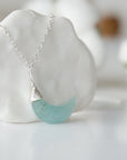 Right side angle of aquamarine moon necklace for women, minimalist wire wrapped, sterling silver