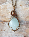 Detailed front view of genuine aquamarine necklace, artisan wire wrapped in antique bronze copper by Designs by Nature Gems.