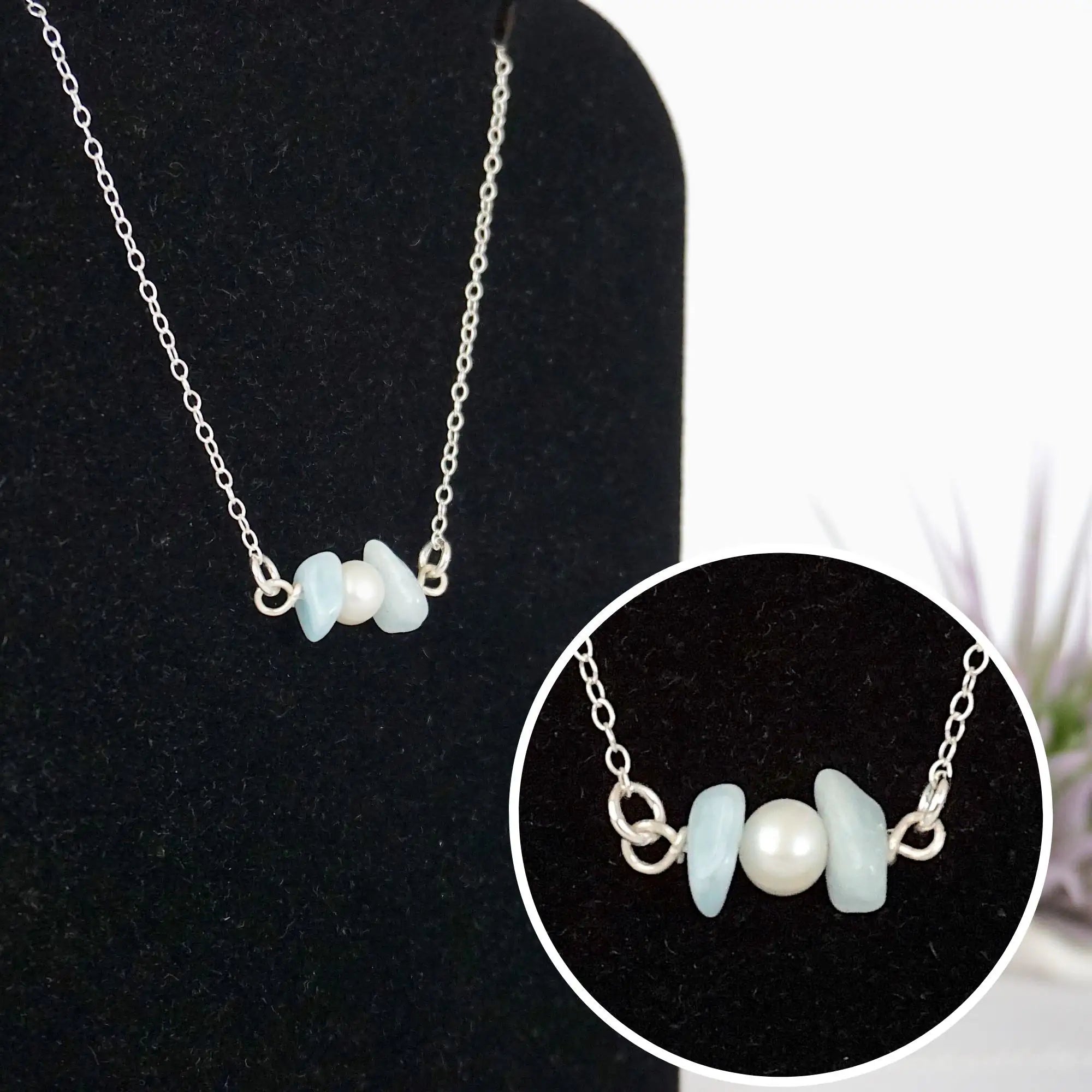 Close-up of raw aquamarine stones and freshwater pearl bar on 925 sterling silver necklace