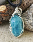 Back view of polished aquamarine pendant, genuine stone with handcrafted sterling silver wire, men's necklace