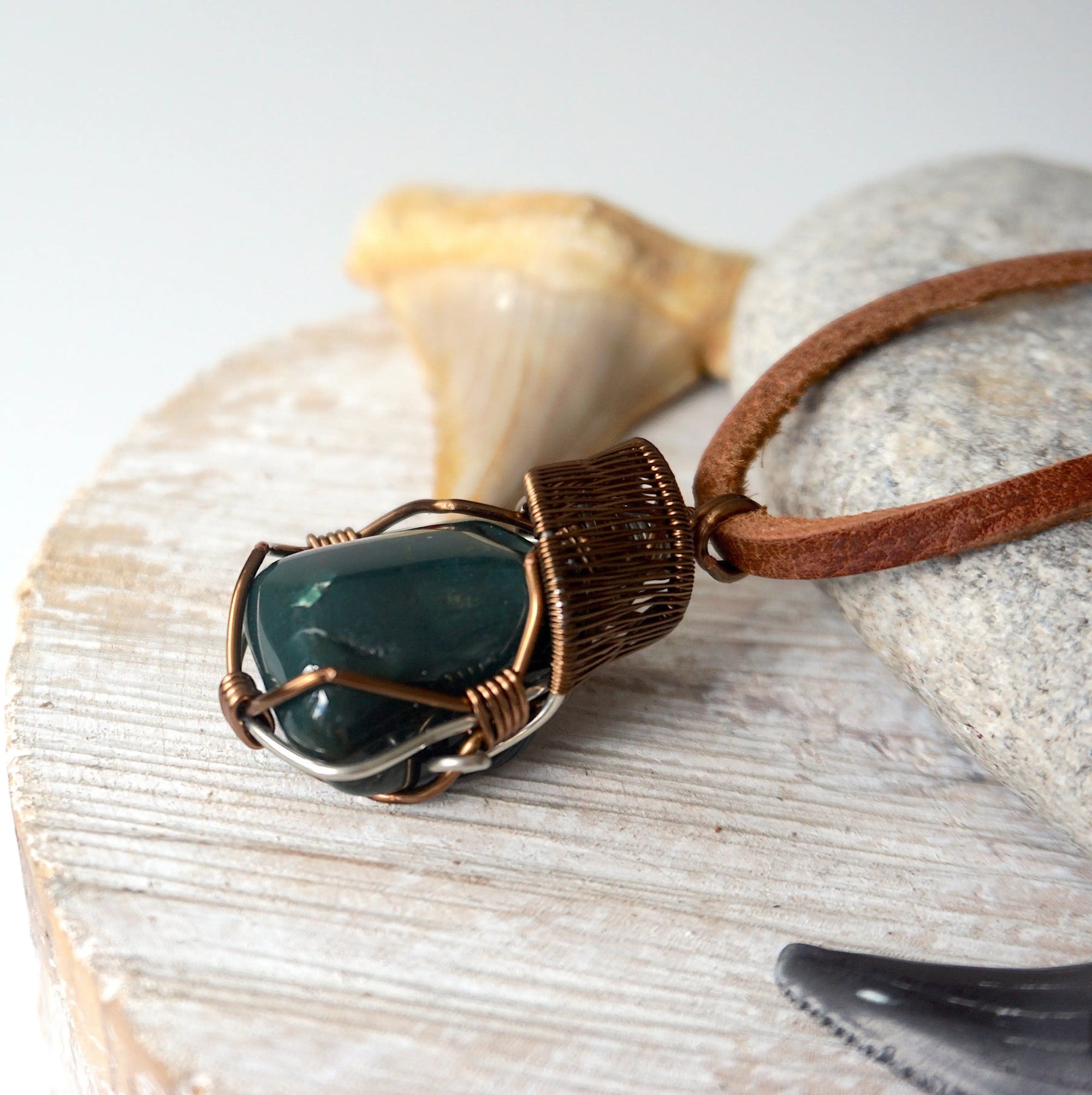 Side angle view of natural bloodstone necklace, showing artisan wire wrap detail, by Designs by Nature Gems.