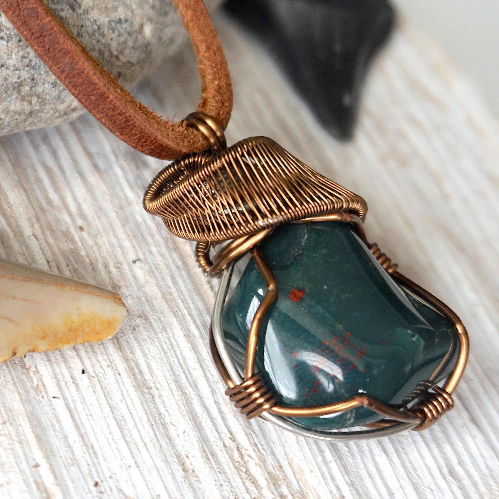 Detailed side angle of natural bloodstone necklace, artisan wire wrapped pendant by Designs by Nature Gems.