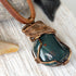 Detailed side angle of natural bloodstone necklace, artisan wire wrapped pendant by Designs by Nature Gems.