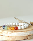 Left side view of chakra beaded stretch bracelet, natural white howlite and 7 chakra gemstone beads