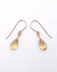 Side angle of citrine drop earrings, minimalist artisan wire wrapping, 14k gold filled