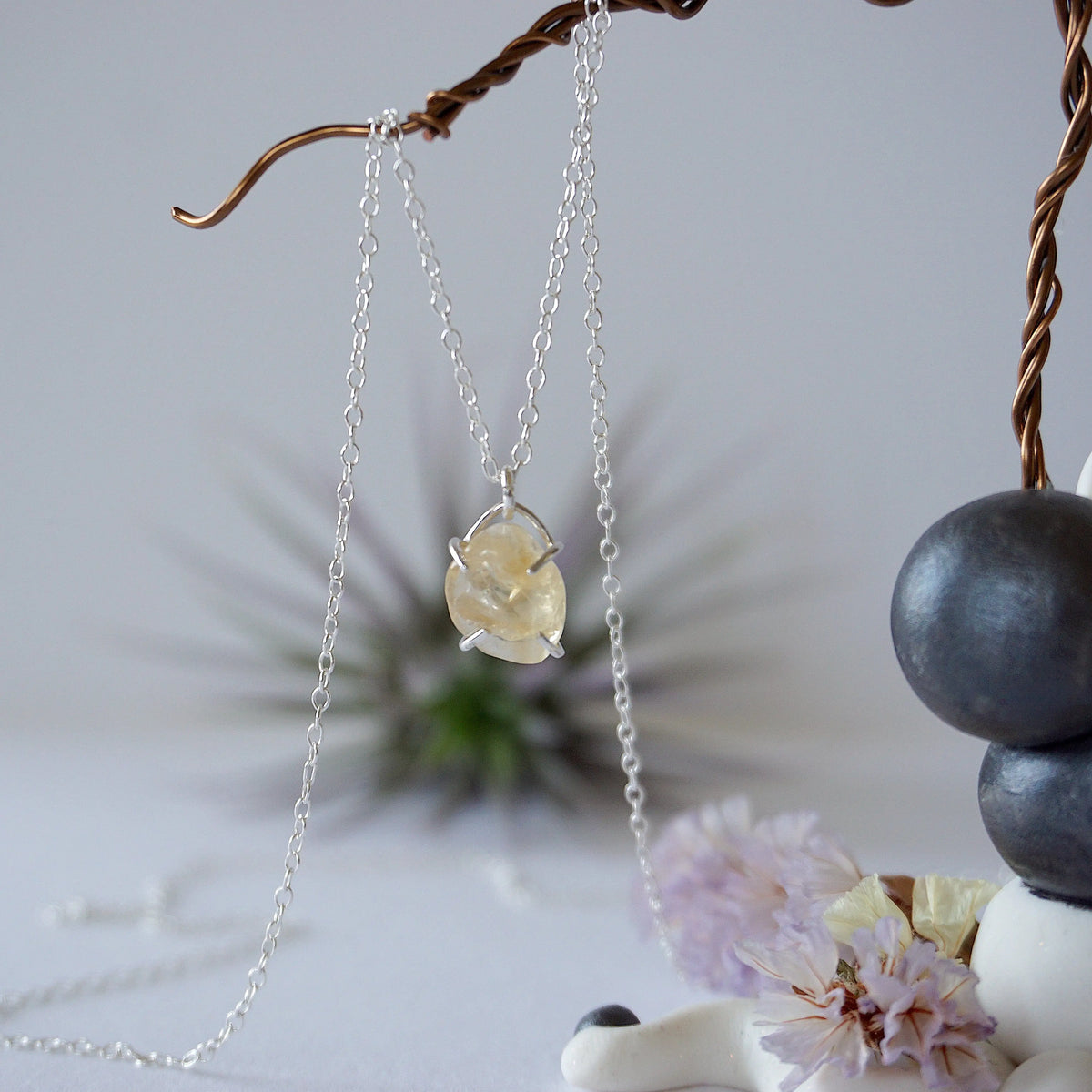 Close up front view of natural citrine crystal wire wrapped in sterling silver 925 - huggie necklace pendant detail showing golden gemstone handmade