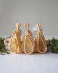 Three citrine necklaces gold wire wrapped showing polished stone size shape and color variation November birthstone options
