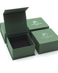 Designs by Nature Gems jewelry box packaging for handcrafted raw emerald stud earrings in 14k gold vermeil