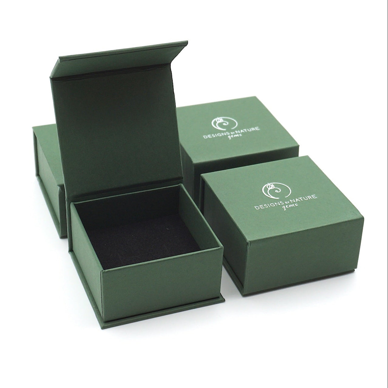 Designs by Nature Gems branded jewelry box packaging for raw rainbow moonstone stud earrings, gift-ready June birthstone jewelry.