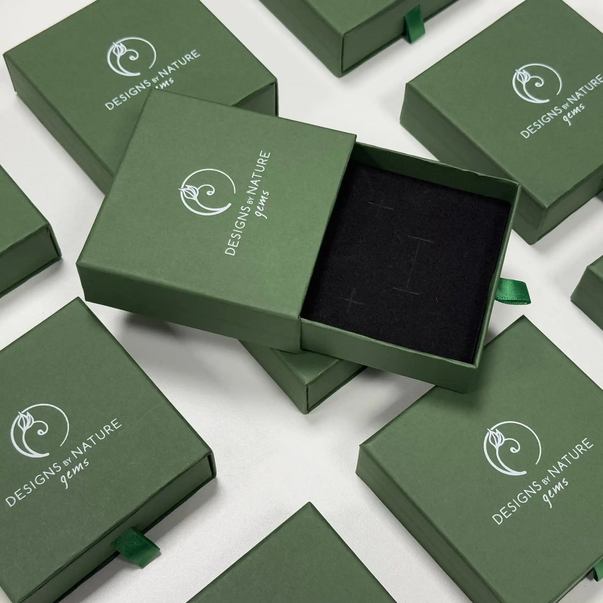 Designs by Nature Gems jewelry box packaging for wire wrapped emerald hoop earrings in soft silver copper