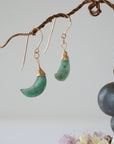 Front view of emerald moon drop earrings in 14k gold filled with natural faceted crescent moon emeralds.