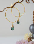 Faceted emerald hoop drop earrings in warm gold copper with natural emerald drops and minimalist artisan design