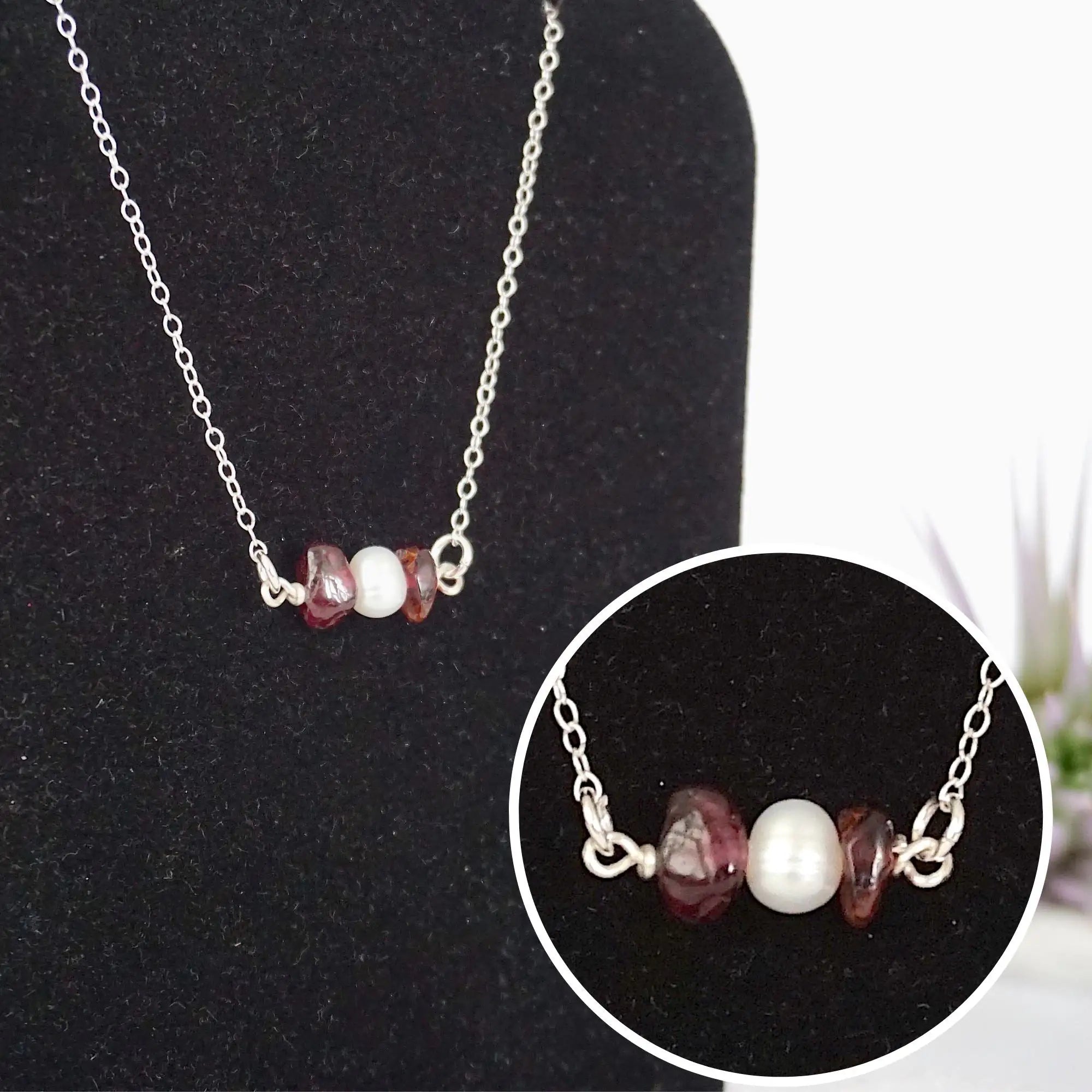 Close-up of raw garnet stones and freshwater pearl bar on 925 sterling silver necklace