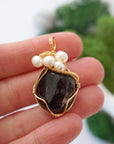 Garnet and freshwater pearl necklace pendant in hand for size reference, artisan birthstone jewelry gift for her