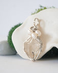 Side angle of handmade herkimer diamond and freshwater pearl pendant necklace, silver wire wrapped jewelry