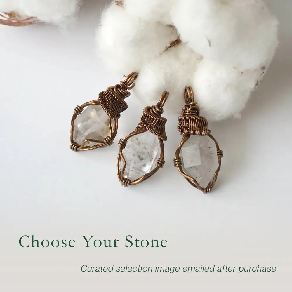 Three raw Herkimer diamond pendants for men showing natural variation in crystal shape, size, and artisan wrapping.
