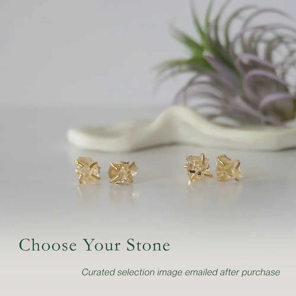 Two pairs of raw Herkimer diamond stud earrings showing natural variation in crystal shape and size.