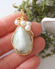 Jade and freshwater pearl necklace pendant in hand for size reference, artisan birthstone jewelry gift for her