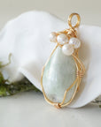 Side angle detail of jade and freshwater pearl pendant, gold wire wrapped, ethical artisan necklace