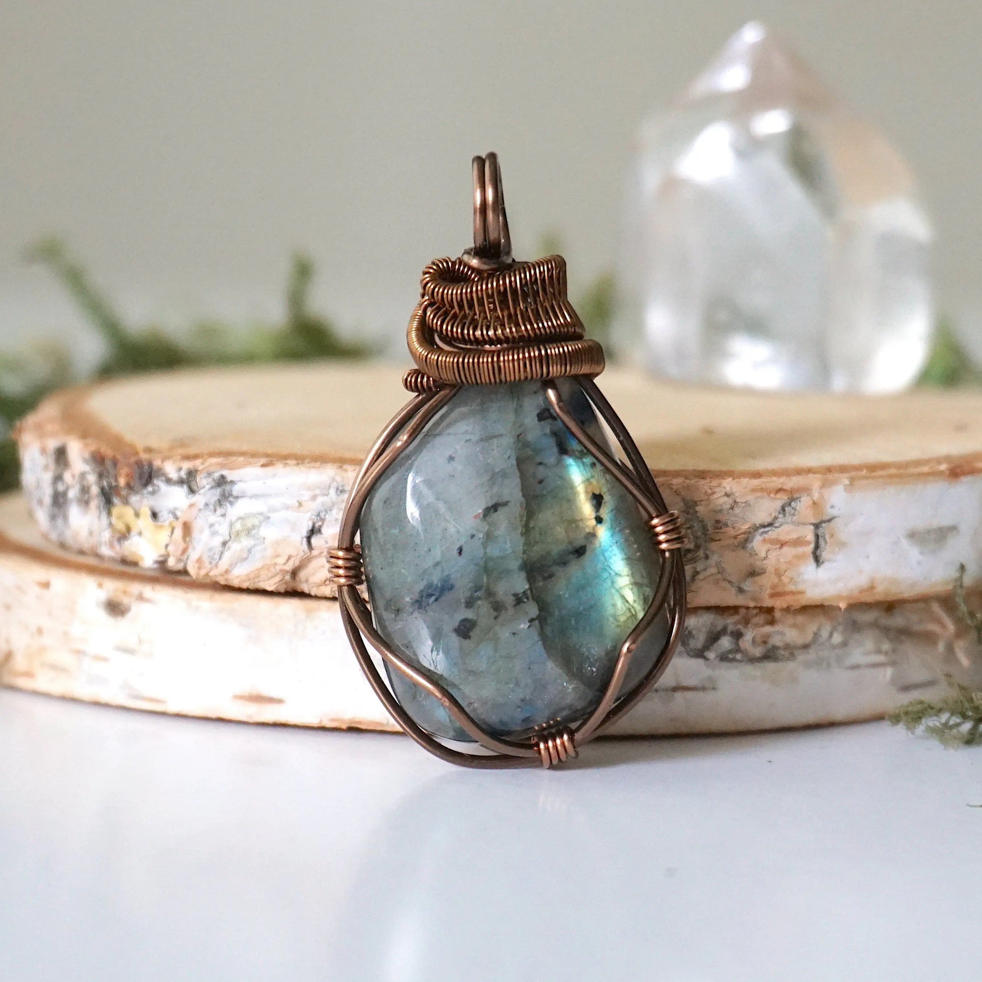 Labradorite necklace front view — polished-raw stone with blue teal flash, antique bronze wire wrapped pendant for women