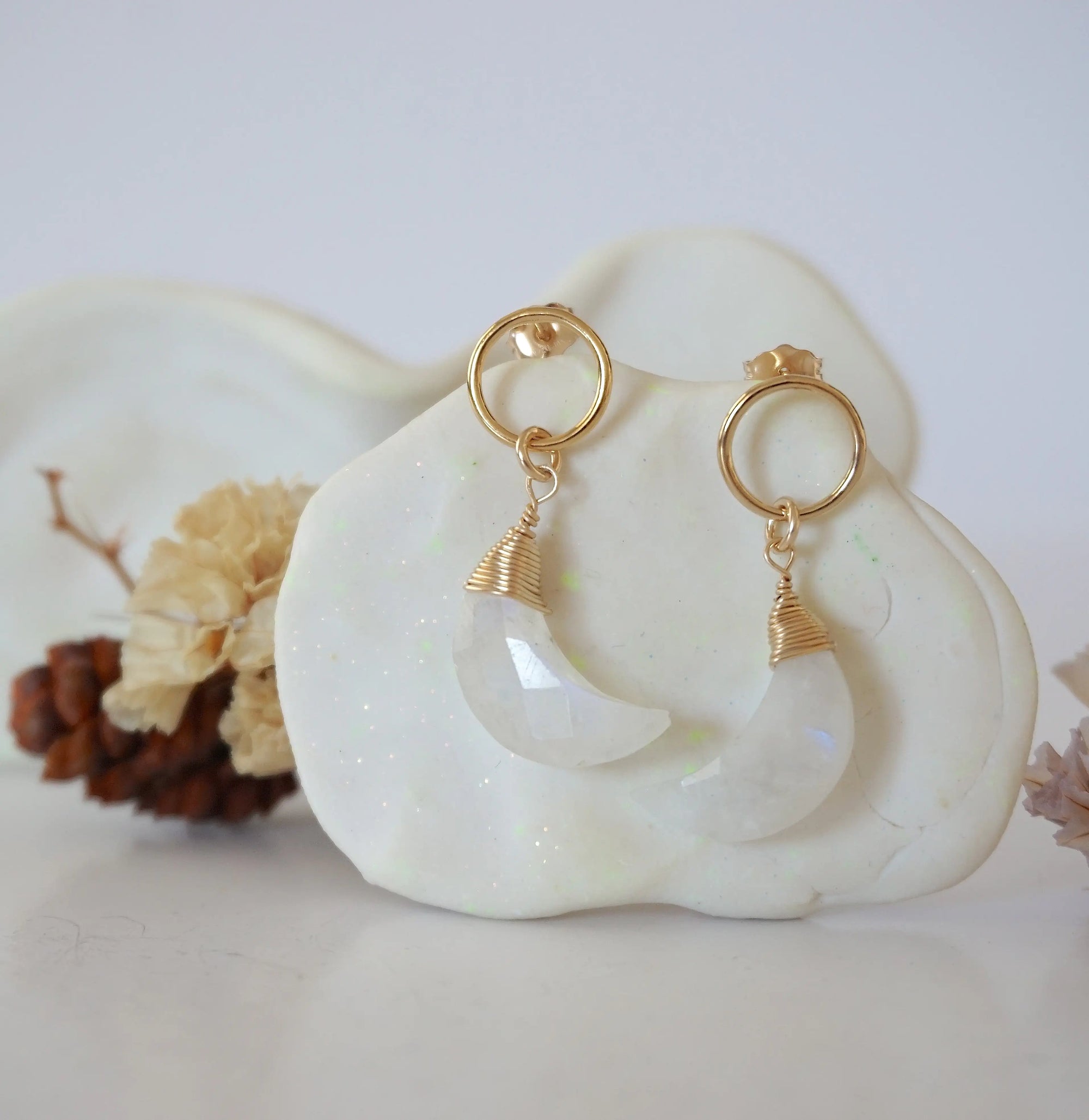 Detailed close-up of Lux Limited Edition Rainbow Moonstone Moon Open Circle Stud Earrings on jewelry display, faceted natural rainbow moonstone, 14k gold filled, handmade.
