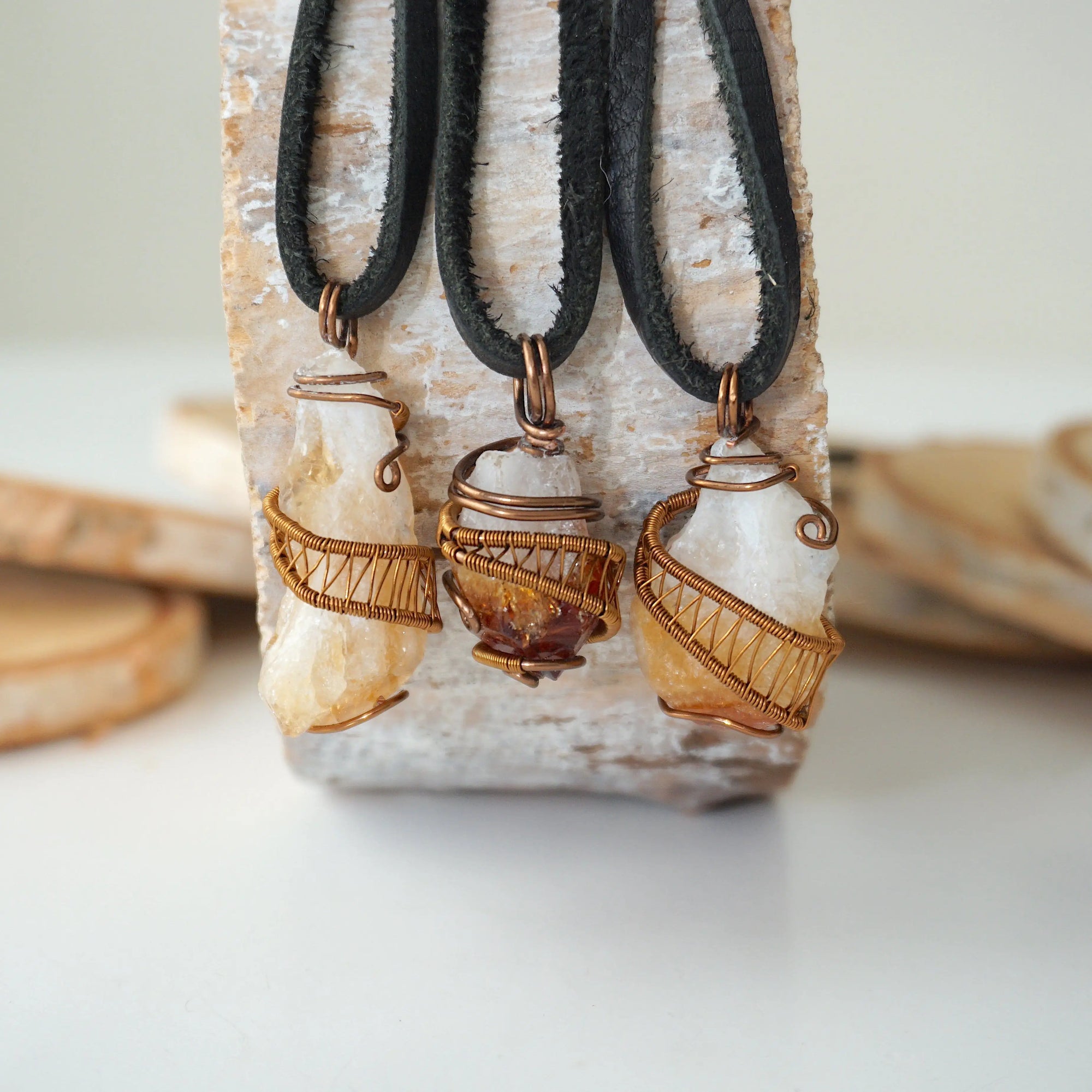 Three raw citrine crystals showing variation in mens necklace pendants - different sizes shapes colors natural unpolished antique bronze wire wrapped unique one of a kind masculine