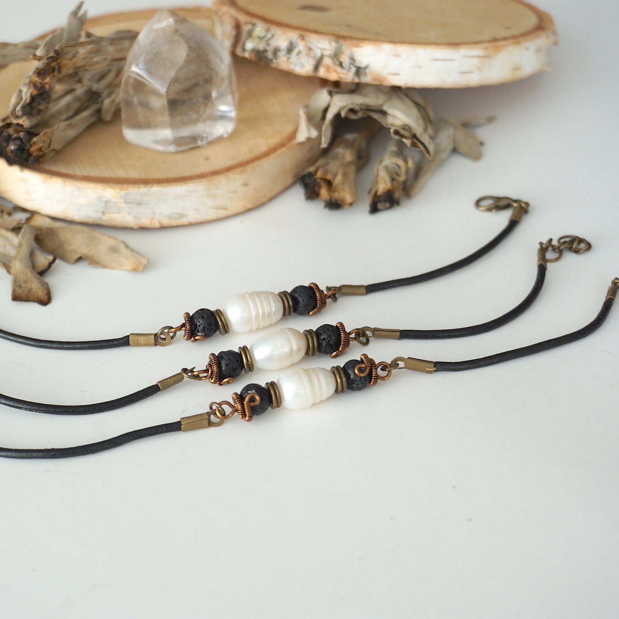 Three men’s pearl leather bracelets showing natural variation in the shape of freshwater pearls