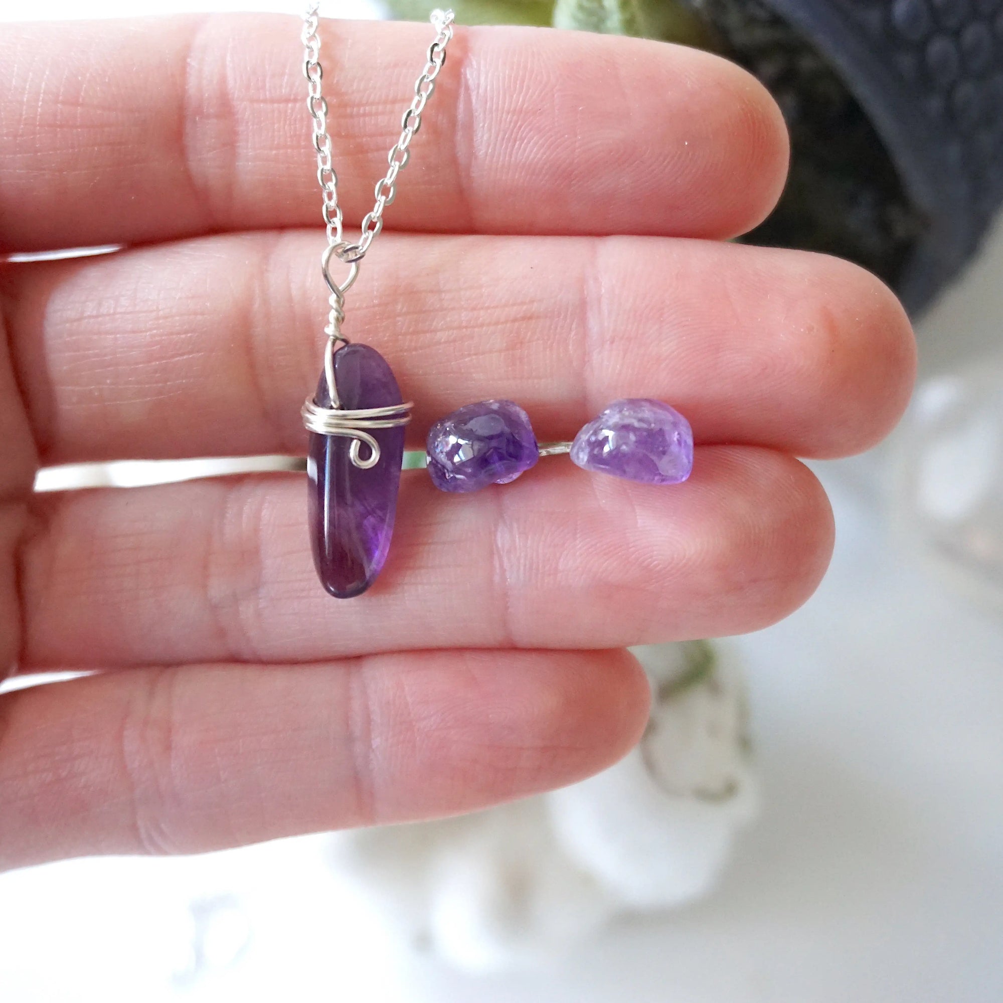 Amethyst necklace and stud earrings shown in hand for size reference, minimalist February birthstone jewelry set in silver